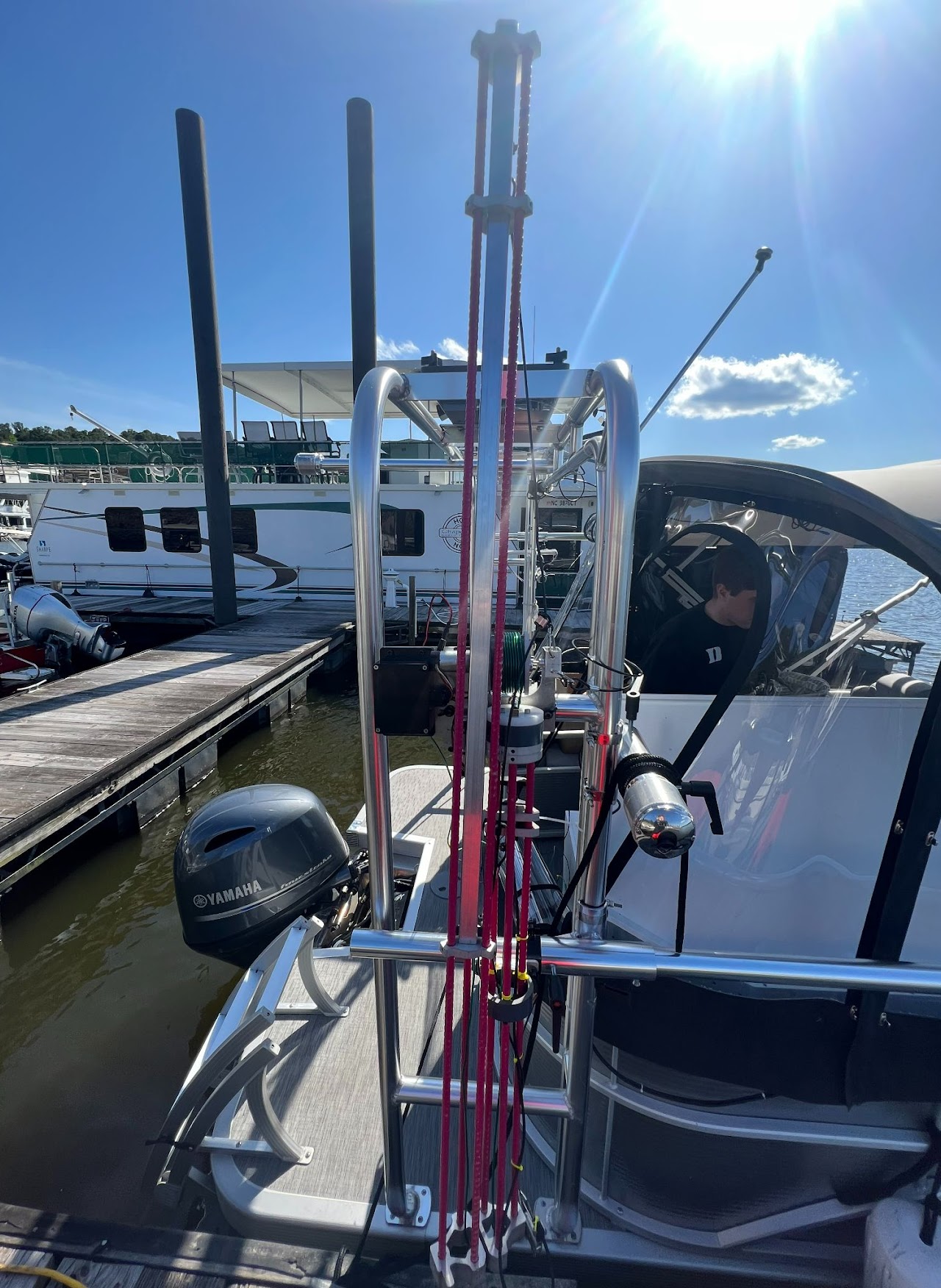 A long pole-shaped device, made of aluminum and fiberglass rebar, mounted to the side of a boat.